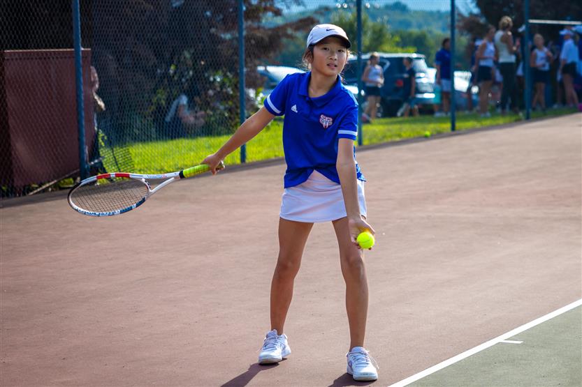 Students play tennis